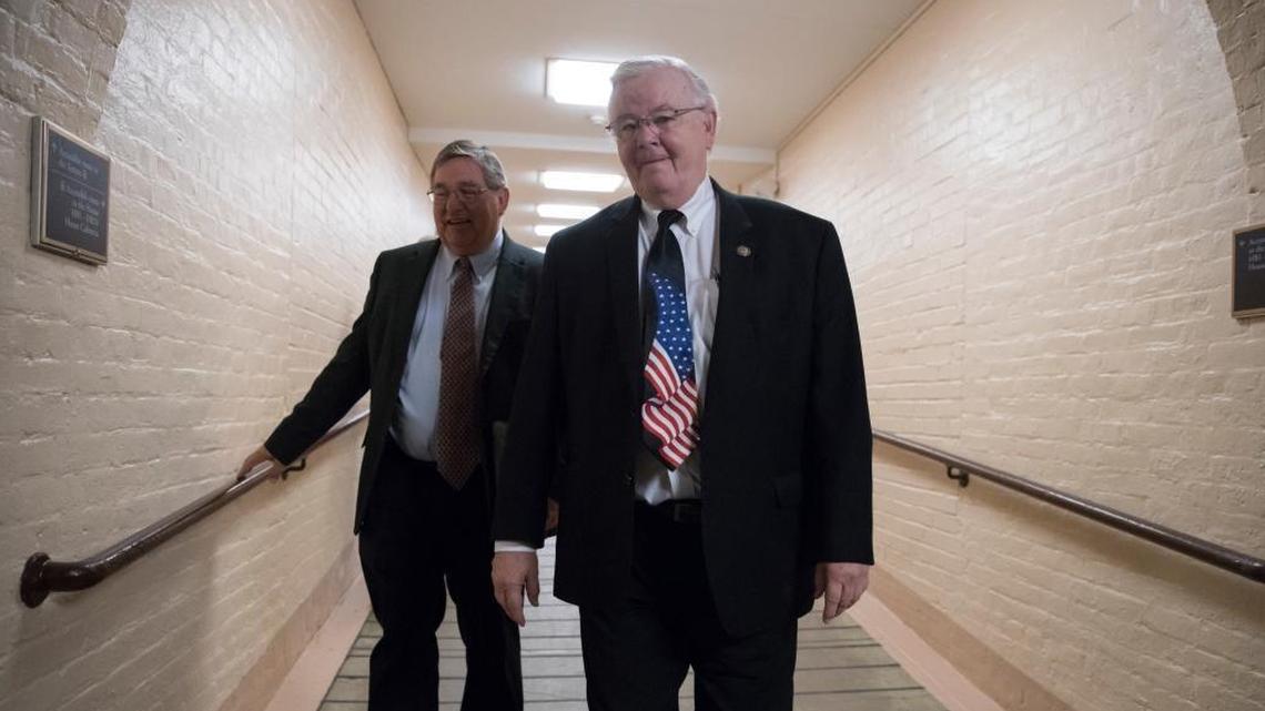 Rep. Michael C. Burgess, R-Texas, left, and Rep. Joe Barton, R-Texas, right, walk to a meeting with fellow House Republicans as work in Congress resumes following the August recess, at the Capitol in