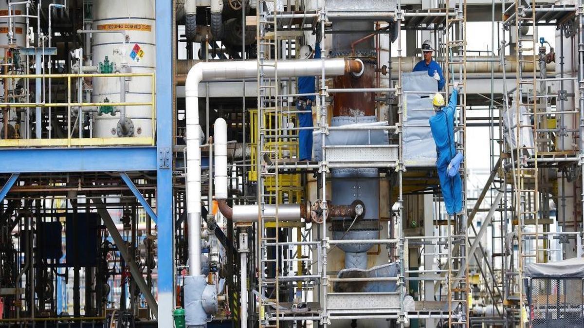 Workers conduct maintenance amid the pipes, chemical tanks and reactors at REC Silicon, a plant in Moses Lake, Wash., that employs 280 employees. REC Silicon makes polysilicon, a key component in solar panels. China was once its largest customer.