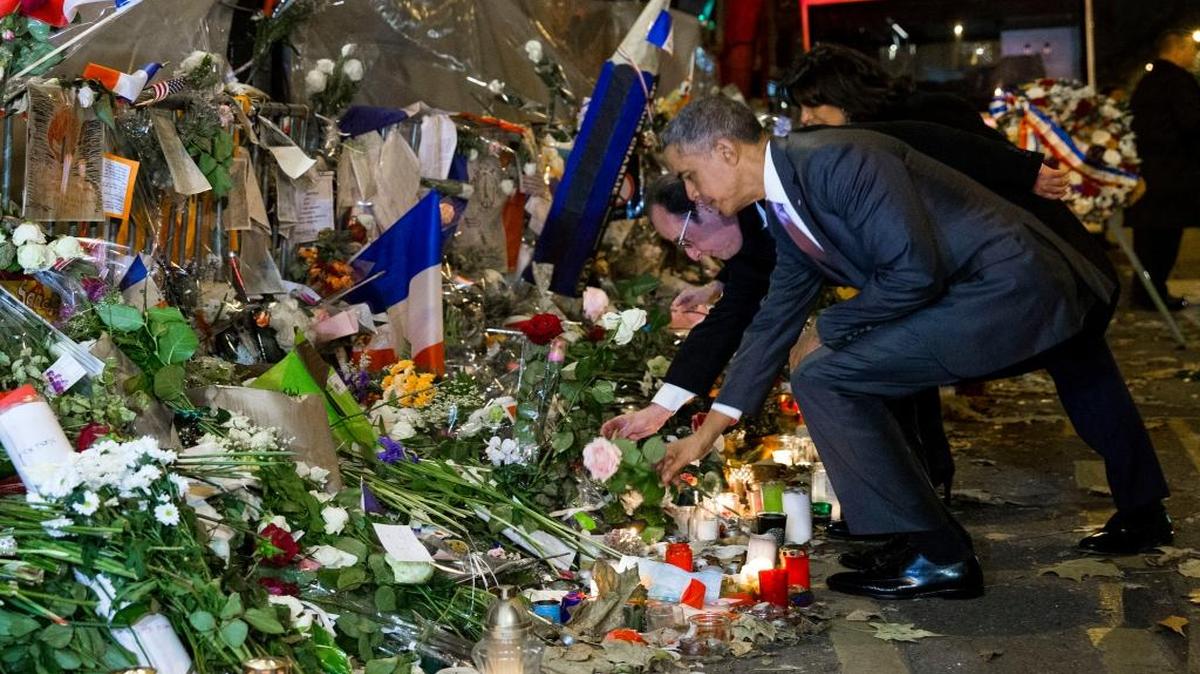 President Barack Obama and French President Francois Hollande placed flowers Monday at the Bataclan, the theater where 89 people died during the Nov. 13 terrorist attacks in Paris.