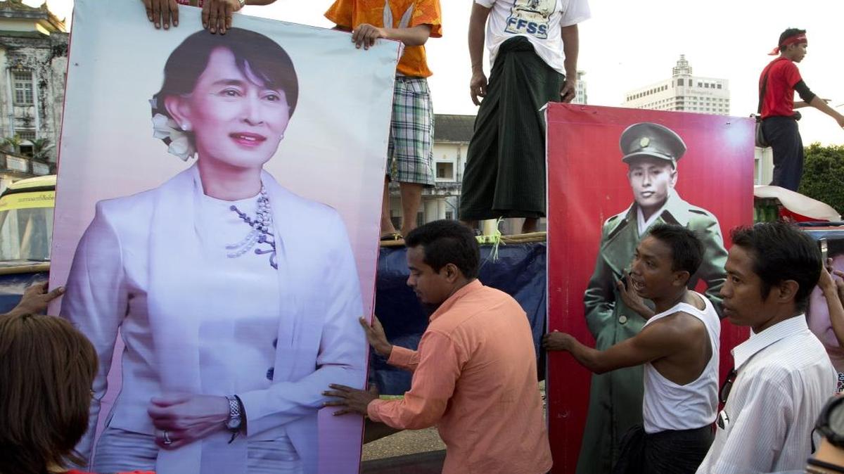 Supporters of Myanmar opposition leader Aung San Suu Kyi’s National League for Democracy party place posters of her and her father, Aung San, at an event to celebrate the final day of campaigning in Yangon, Myanmar, Thursday, Nov. 5, 2015. On Sunday, Myanmar will hold what is being viewed as the country’s best chance for a free and credible election in a quarter of a century.