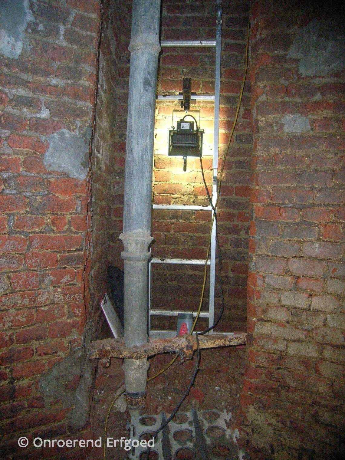 The bottom of the vertical shaft with the ladder archaeologists used to enter.