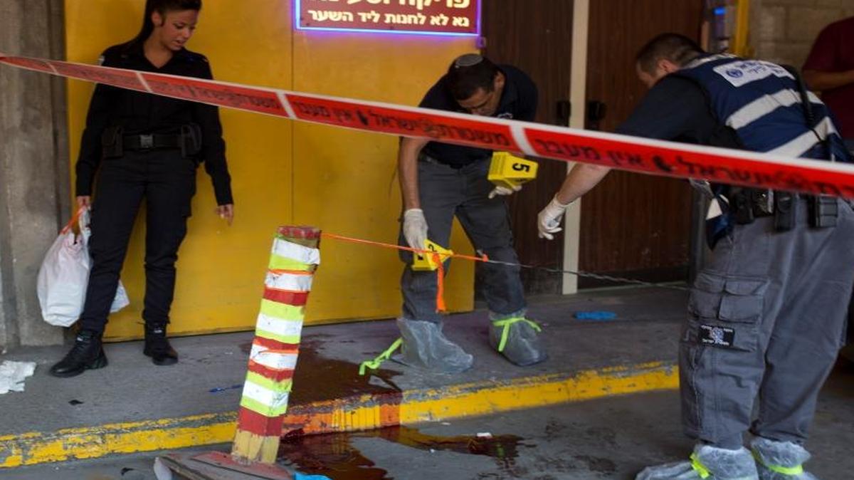 Israeli police investigate the scene of Thursday’s stabbing in Tel Aviv.