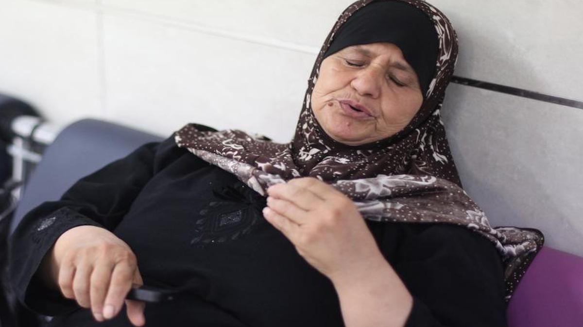 
Mazouza Odeh, mother of Palestinian prisoner Mohammad Allan, slumps against a wall of Barzilai Medical Center in Ashkelon on August 18, 2015. Allan, who has been on hunger strike, regained consciousness Tuesday after more than 60 days of fasting to protest his incarceration without charges.
