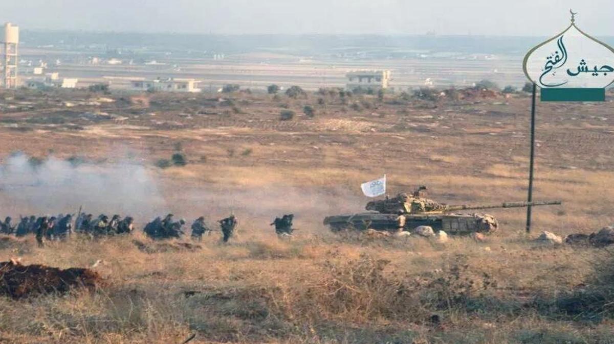 
In an image taken from Twitter last month, rebel fighters belonging to the Ahrar al Sham are shown moving against pro-government gunmen in the northwestern province of Idlib, Syria. The Syrian army, backed by Russian airstrikes, has launched an offensive in Idlib to retake the area from rebels. 
