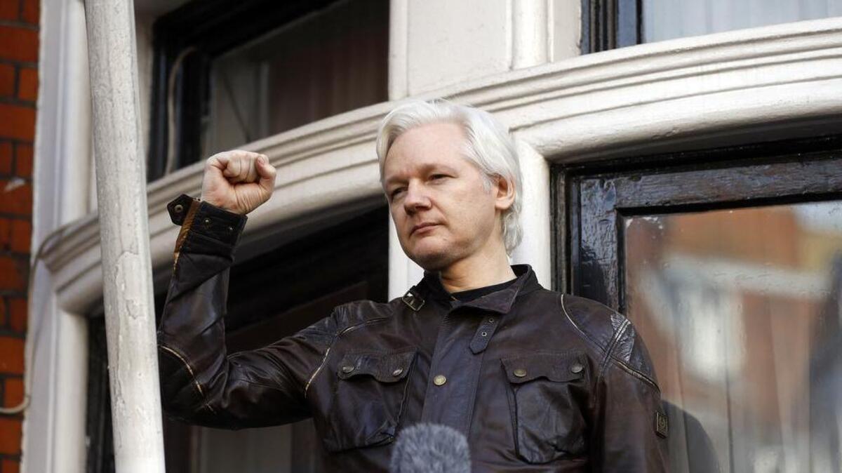 Julian Assange greets supporters outside the Ecuadorian embassy in London, Friday May 19, 2017. Assange took refuge in Ecuador's embassy in London in 2012 to escape extradition to Sweden to answer questions about sex-crime allegations from two women.