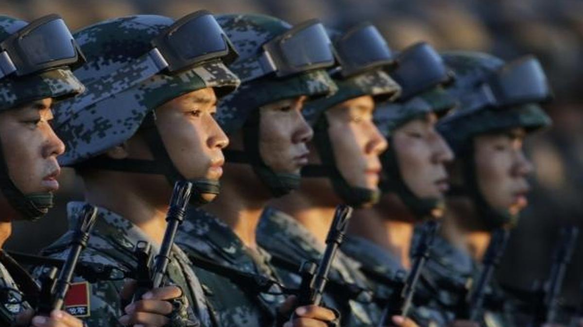 Soldiers of China's People Liberation Army (PLA) stand in line in front of Tiananmen Gate ahead of a military parade to commemorate the 70th anniversary of the end of World War II in Beijing on Sept. 3, 2015.