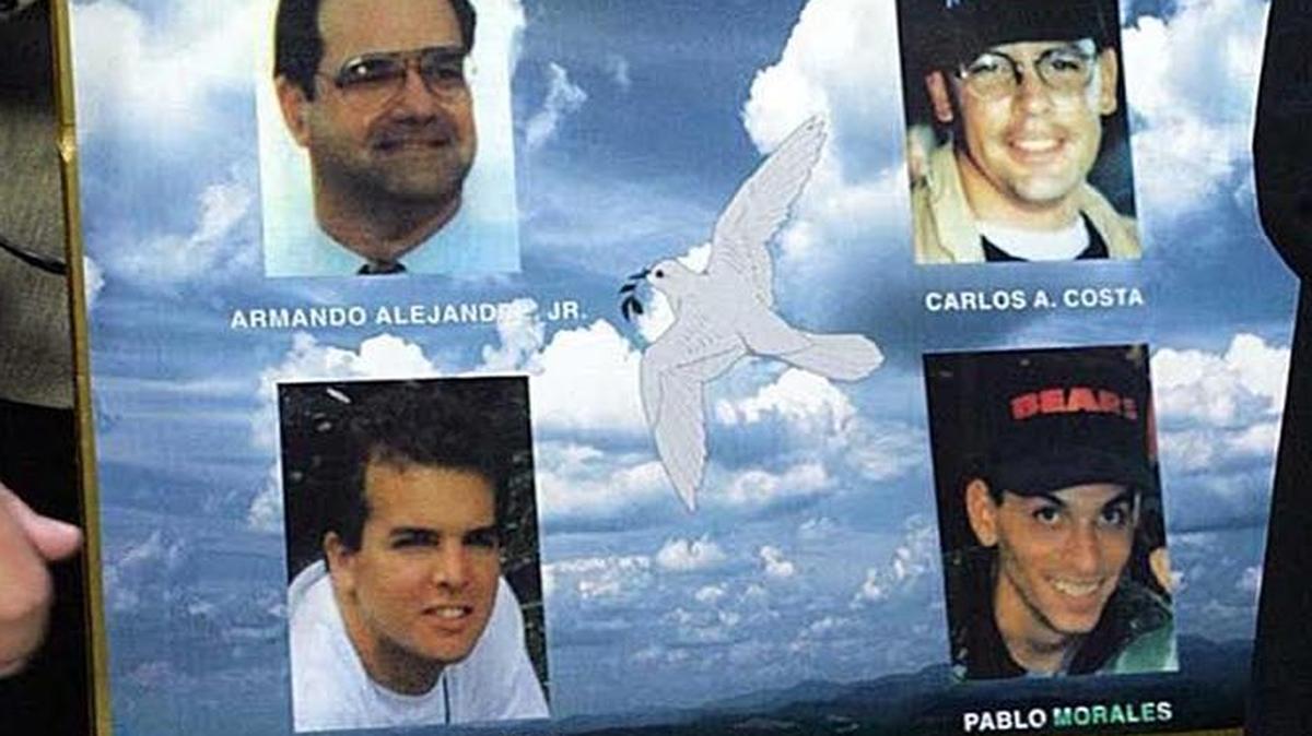 Maggie Khuly, sister of Armando Alejandre, one of the victims of the Brothers to the Rescue shootdown, and Mirta Costa, mother of another victim, Carlos Costa, held photos of the four who were killed when a Cuban MiG downed two small planes in 1996.