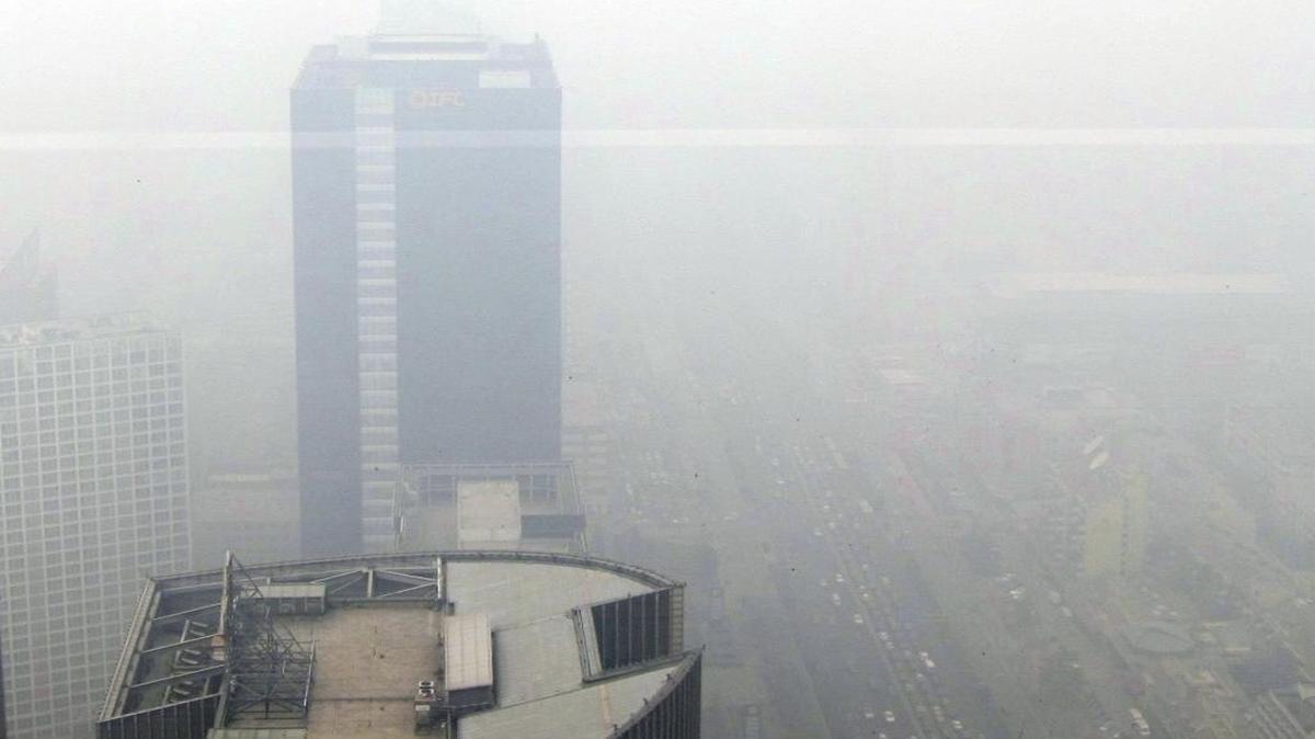 The view Monday, Feb. 24, 2014, from the 65th floor of the Park Hyatt, one of Beijing’s elite hotels.