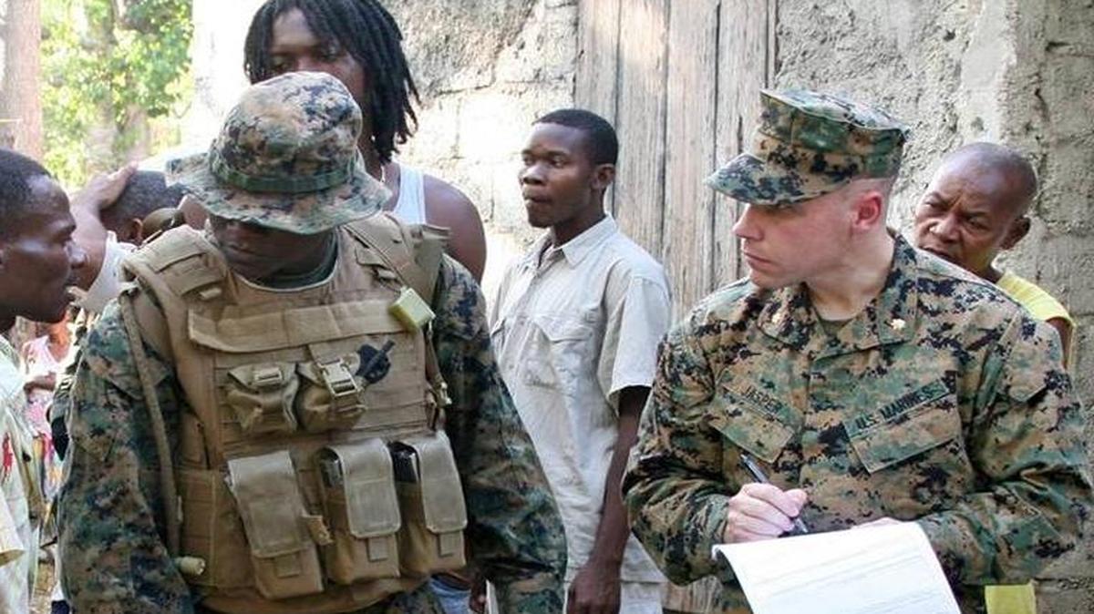 
Marine Lt. Col. Thomas Jasper, right, was one of the lawyers fired by Abd al Hadi al Iraqi. He’s shown here in a Pentagon handout photo from 2010. 
