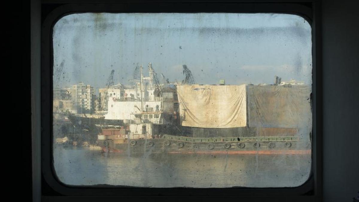 
Boats at the port of Tripoli, Lebanon, are photographed through a window of the ferry Lady Su, which carries Syrian refugees traveling from Tripoli to Taşucu, Turkey. Photo taken Sept. 22, 2015.
