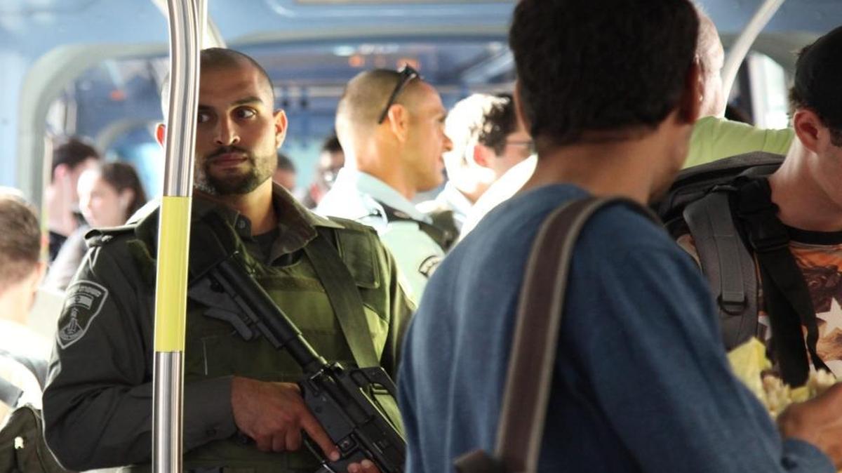 An Israeli reservist guards the Jerusalem light rail on Wednesday, October 14, 2015. Israel dispatched six companies of reservists across major cities in an effort to contain a wave of violent attacks that has rattled the capital.