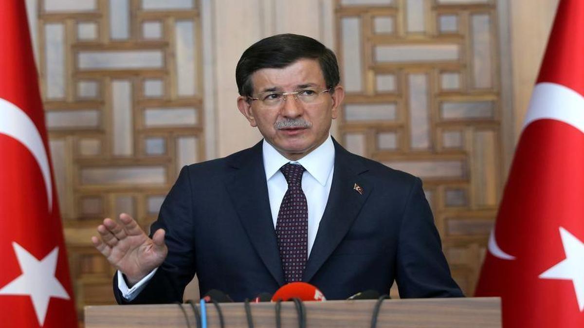 
Turkish Prime Minister Ahmet Davutoglu talking to reporters in Ankara Friday, July 24, 2015, after Turkish warplanes struck Islamic State targets across the border in Syria. Davutoglu said the airstrikes had "removed potential threats" to Turkey and targets were hit with "100 percent accuracy." 
