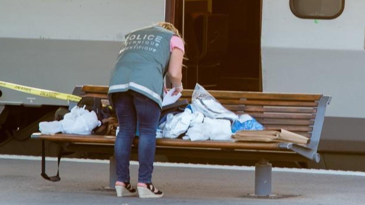 
A police officer works near a train in Arras, France, after a gunman opened fire injuring three passengers Friday. News reports said Americans thought to be Marines broke up the attack after they heard the gunman loading his weapon. 
