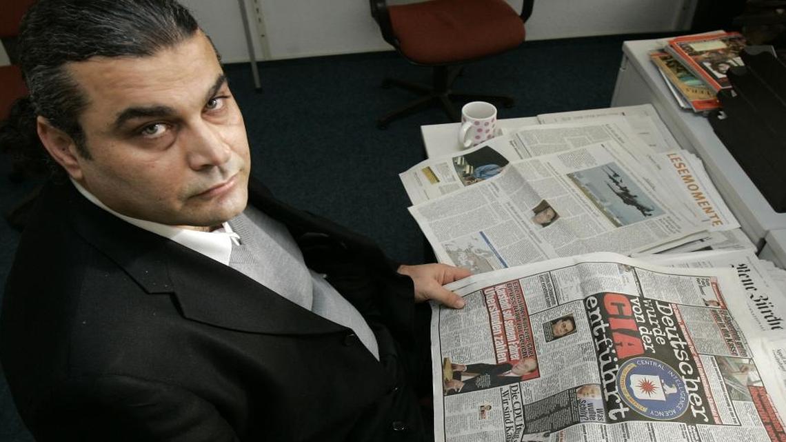 German of Lebanese descent Khaleed al Masri reads German newspapers covering his arrest by the CIA in Stuttgart, Germany, on Dec. 6, 2005.