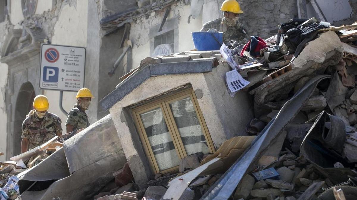 Soldiers search amid rubble of a collapsed house following an earthquake in Amatrice, central Italy, Wednesday, Aug. 24, 2016. A strong earthquake in central Italy reduced three towns to rubble as people slept early Wednesday, with reports that at least 73 people were killed and hundreds injured as rescue crews raced to dig out survivors.