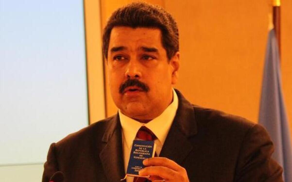 President Nicolas Maduro of Venezuela holding a small copy his country’s constitution as he spoke to the U.N. Human Rights Council Thursday.