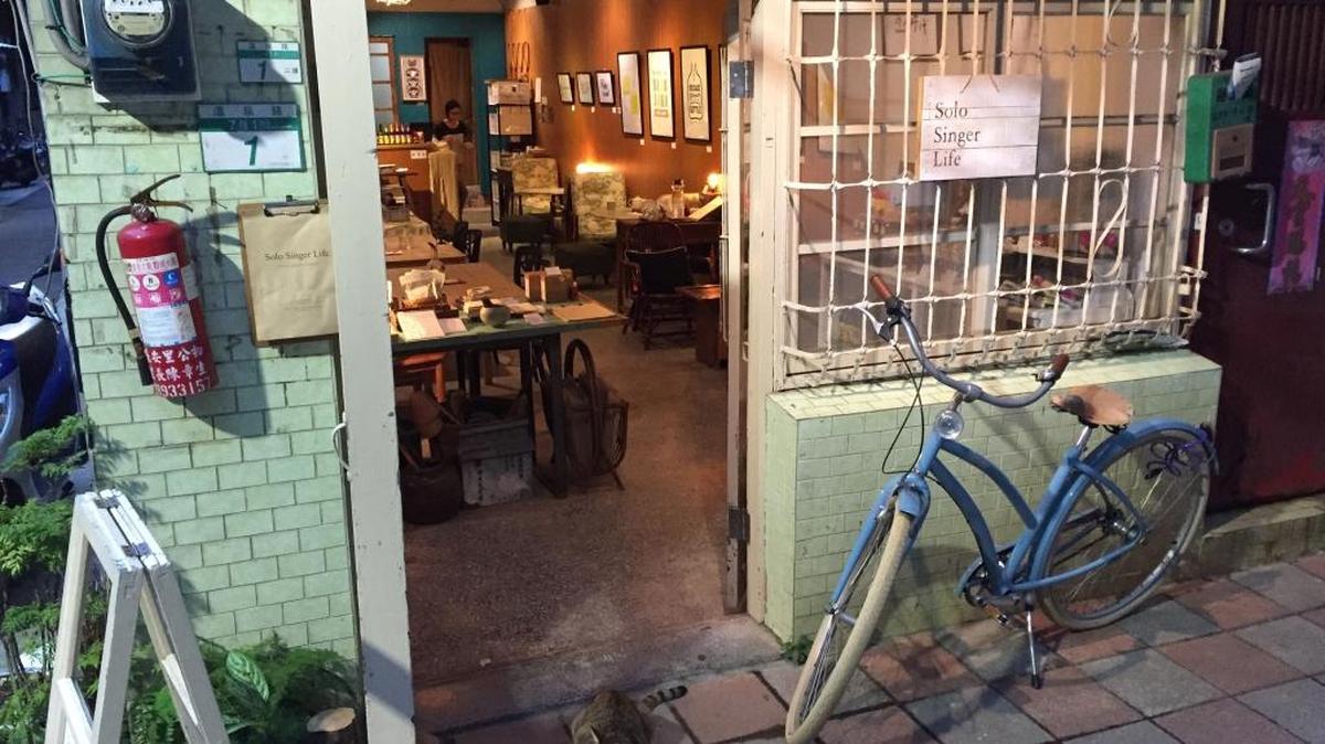 A cat welcomes customers to Solo Singer Life, a cafe in the alleys of Beitou, a suburb of Taipei, in Taiwan on Nov. 21, 2015. The cafe is an annex of Solo Singer, a bed-and-breakfast that attracts travelers seeking a more artsy experience in this hot springs village of luxurious resorts.