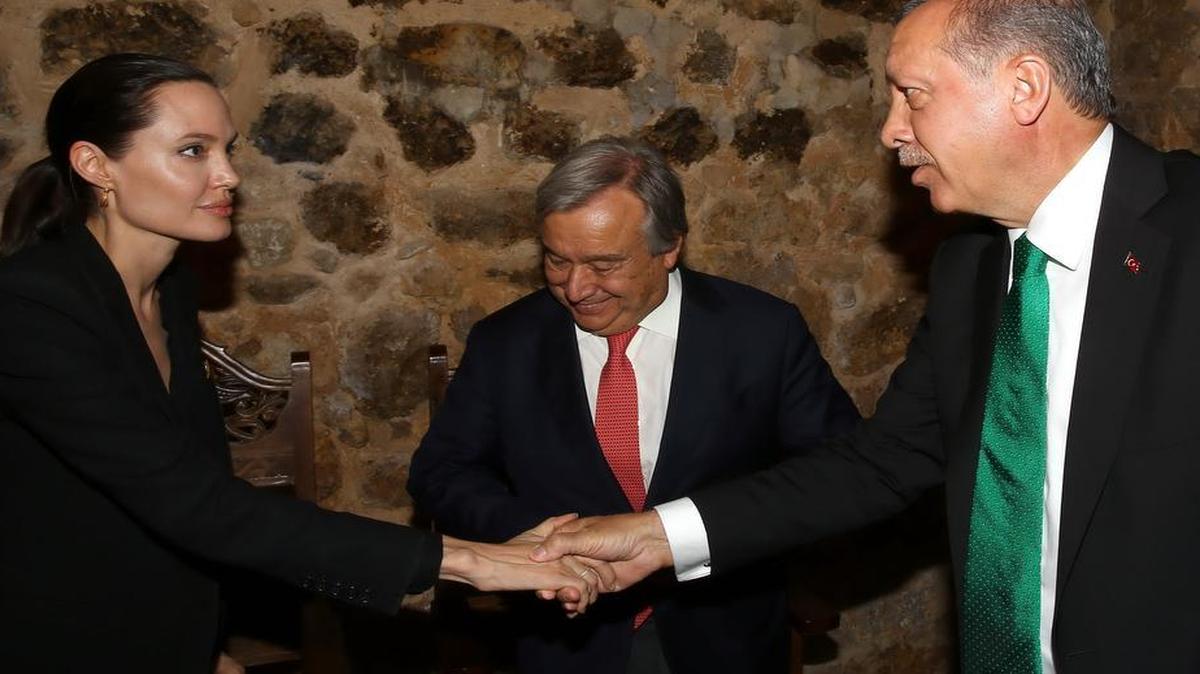 
As U.N. High Commissioner for Refugees Antonio Guterres looked on, Turkish President Recep Tayyip Erdogan greeted Angelina Jolie, who’s a special U.N. envoy for refugees, June 20 during a visit to the Midyat refugee camp in Mardin, Turkey. Turkey hosts more than 1.5 million Syrian refugees, one reason diplomats cite for its policy toward the Islamic State.
