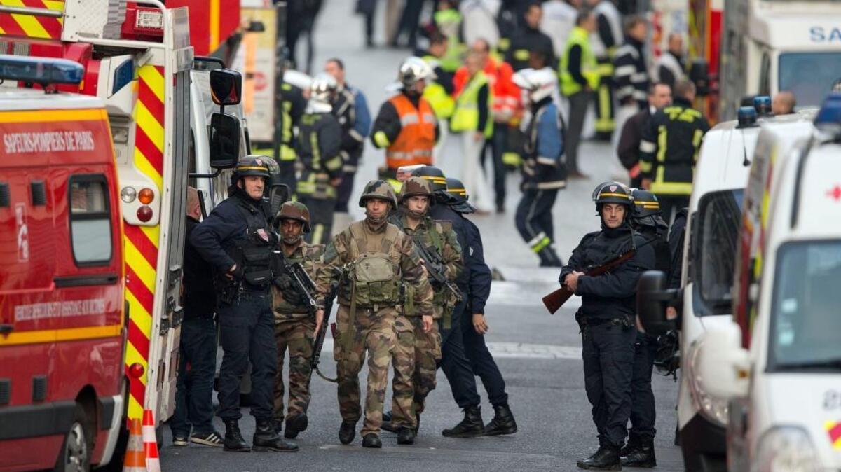 French soldiers and police during Wednesday’s raid in Saint-Denis, near Paris.
