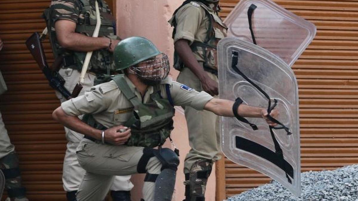 
Indian paramilitary soldiers shield themselves as Kashmiri protesters throw stones during a protest in Indian-controlled Kashmir, India, Friday. The top security advisers of India and Pakistan are scheduled to meet Monday in New Delhi.
