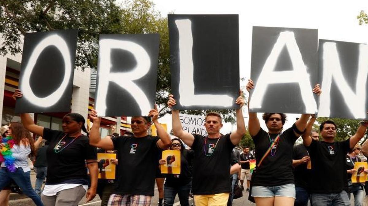 Marchers in the annual Gay Pride parade in West Hollywood spell out Orlando in support of the victims of Sunday's mass shooting.
