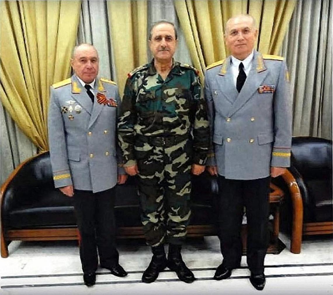 This screenshot from a video posted by an anti-Assad group in Syria shows Russian Colonel General Nikolai Tkachev, left, standing next to the late Syrian Defense Minister Dawoud Rajha. To the right is Russian Major General Vladmir Kuzheev.