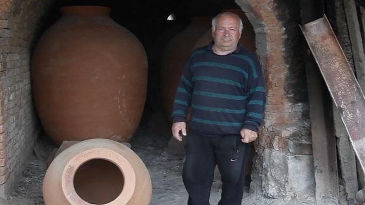 Potter Remi Kbilashvili makes qvevris, or clay pots used in Georgian wine making, in his backyard workshop on April 9, 2015. Wine planning under the Soviet Union sidelined this 8,000-year-old tradition, but now the qvevri is at the forefront of a back-to-the-roots wine revolution in Georgia.