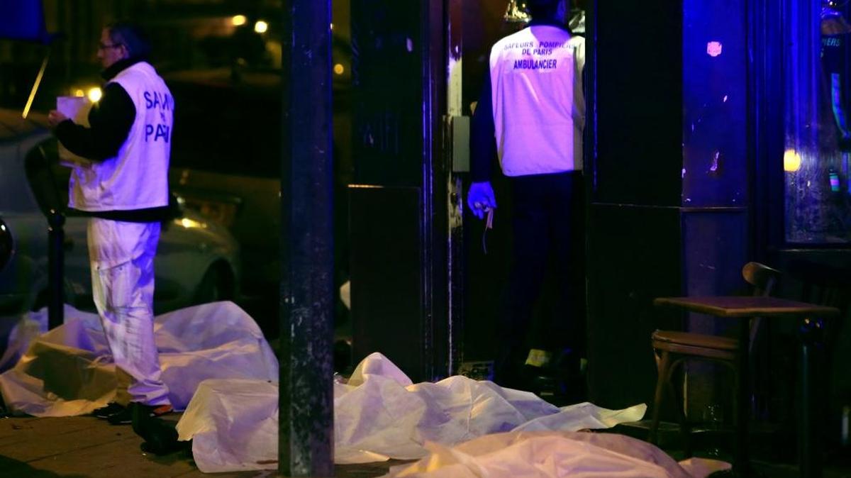 Victims lay on the pavement of a Paris restaurant that was the site of one of six terrorist attacks in the French capital Friday. Authorities were still tabulating the death toll, which was expected to pass 150. Police said they believe all eight of the attackers died.
