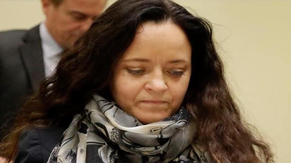 Terror suspect Beate Zschaepe arrives at the court room besides her lawyer Mathias Grasel in Munich, Germany, Thursday, Sept. 29, 2016. Zschaepe is accused of being involved in 10 neo-Nazi murders of the National Socialist Underground group, which allegedly killed eight Turkish men, a Greek and a policewoman between 2000 and 2007.