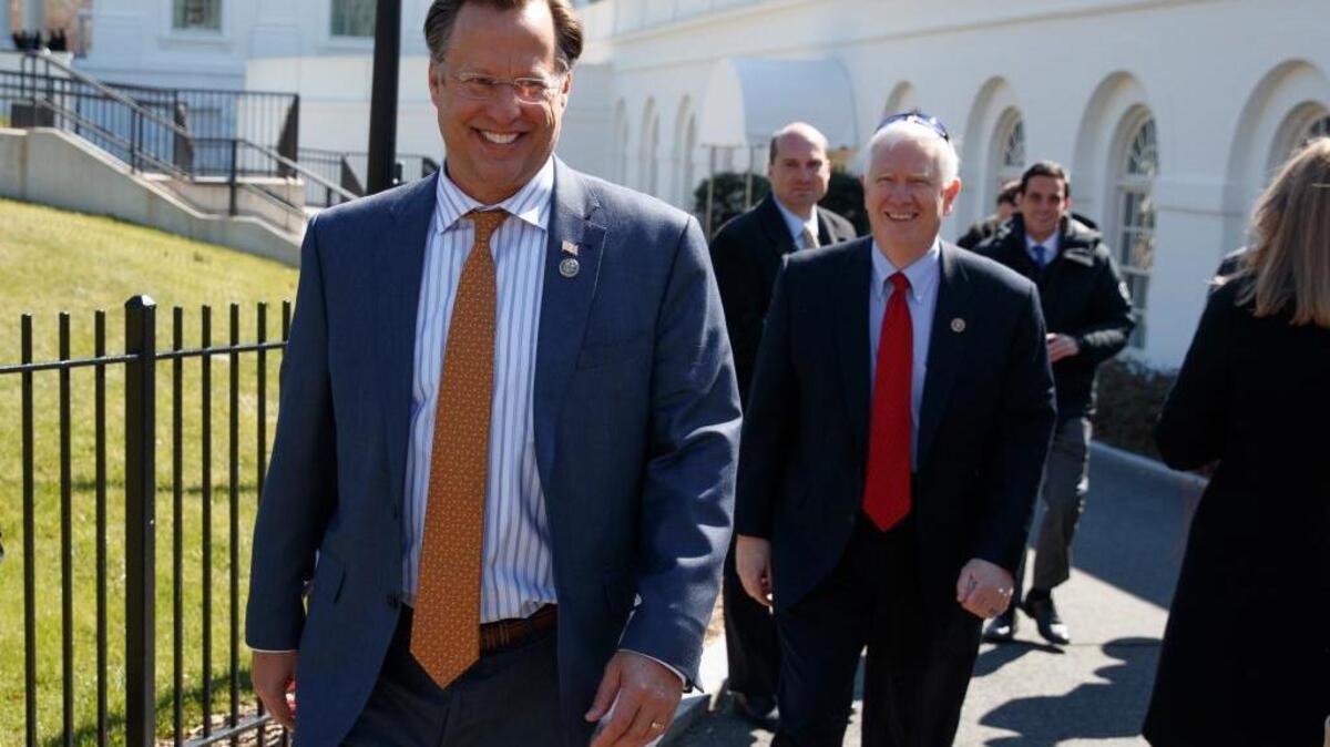 House Freedom Caucus member Rep. Dave Brat, R-Va., and other members, arrives at the White House in Washington, Thursday, March 23, 2017.