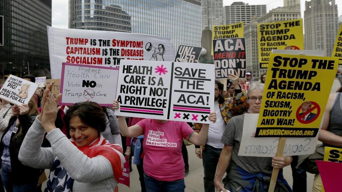 Protesters gather across the Chicago River from Trump Tower to rally against the repeal of the Affordable Care Act, Friday, March 24, 2017, in Chicago. A March McClatchy-Marist poll found that 65 percent of registered voters support either strengthening or maintaining the health care law.