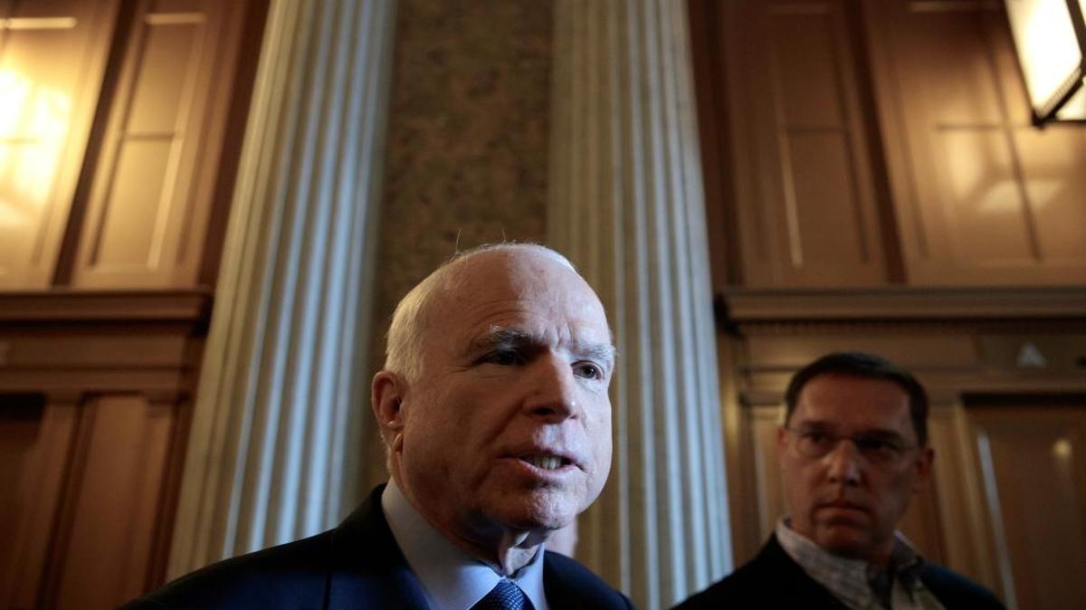 Senate Armed Services Committee Chairman John McCain, R-Ariz., leaves the chamber after speaking about the airstrike in Syria, on Capitol Hill in Washington, Friday, April 7, 2017.