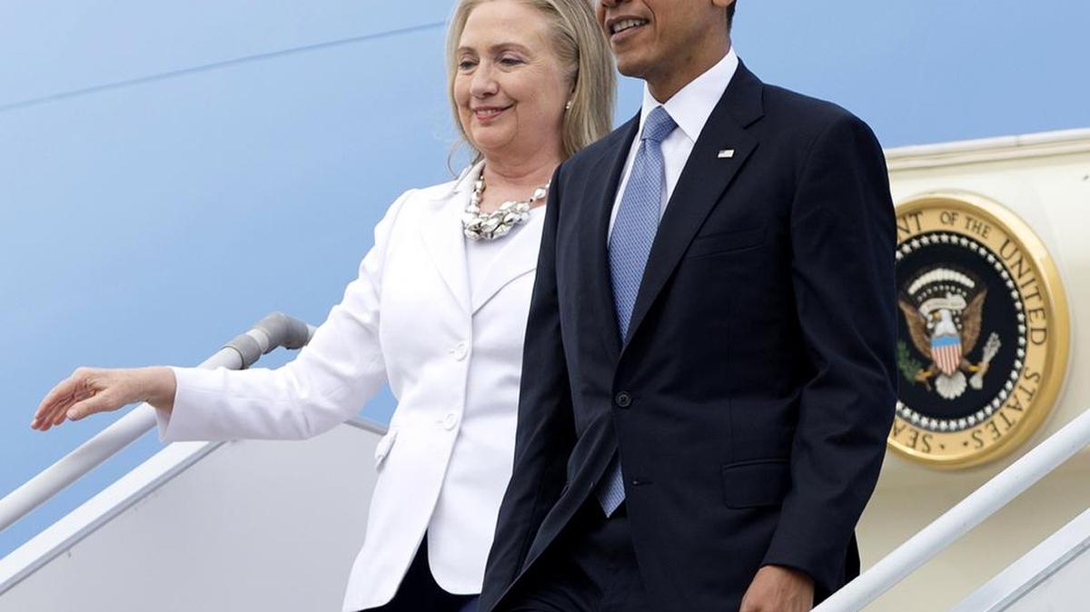 President Barack Obama and then-Secretary of State Hillary Clinton on Air Force One in 2012. They take the stage at their first joint campaign appearance on July, 5, 2016 in Charlotte.