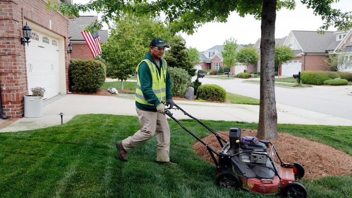 Ruben Lugo from Mexico mows grass on the grounds of the DeVintage subdivision in Cary, NC on April 19, 2017. He is here on an H2B visa, which is for seasonal work. He works for Greenscape, Inc., a Raleigh landscaping company. N.C. Sen. Thom Tillis wants to expand the program.