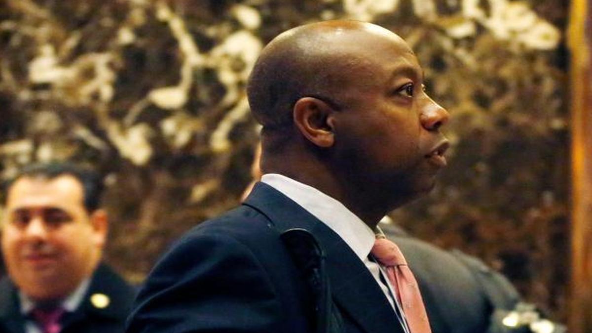 Sen. Tim Scott, R-S.C., center, enters Trump Tower, Dec. 12, 2016, in New York.