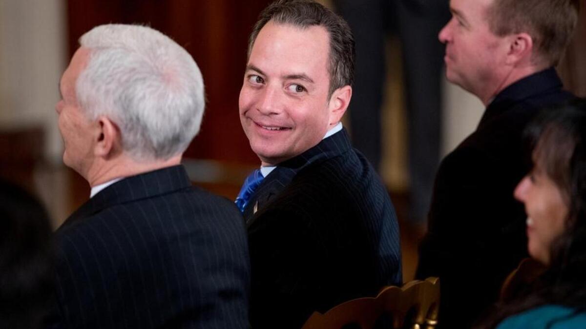 President Donald Trump's Chief of Staff Reince Priebus, center, attends a news conference for President Donald Trump, Thursday, Feb. 16, 2017, in the East Room of the White House in Washington.