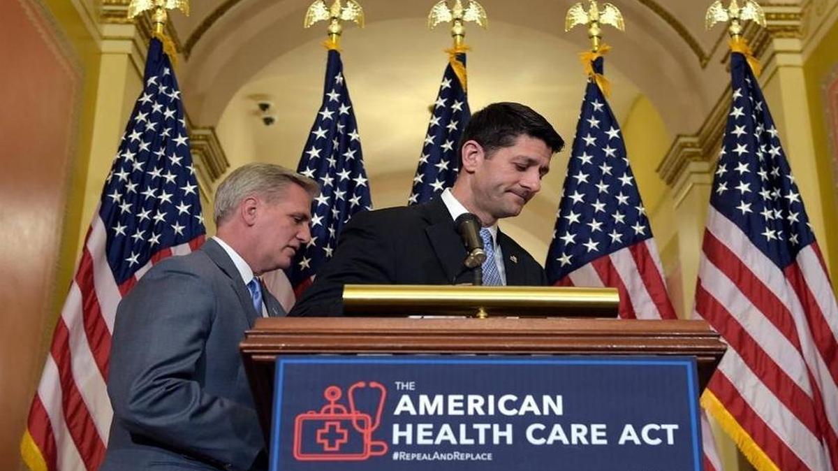 House Speaker Paul Ryan, R-Wis., right, takes his notes as he and House Majority Leader Kevin McCarthy, R-Calif., walk away following a news conference on the American Health Care Act on Capitol Hill in Washington, Tuesday, March 7, 2017.
