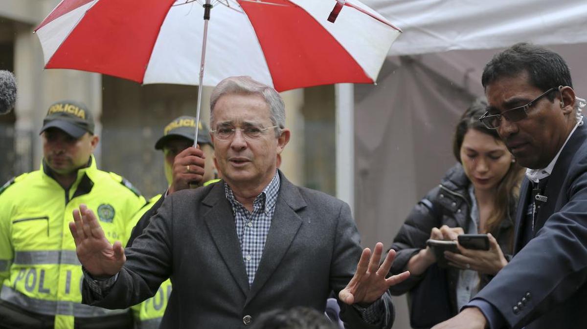 Former President and opposition Senator Alvaro Uribe speaks to journalists after voting in a referendum to decide whether or not to support a peace deal signed between the Colombian government and rebels of the Revolutionary Armed Forces of Colombia, FARC, in Bogota, Colombia, Sunday, Oct. 2, 2016. Uribe opposes the accord arguing that the government is appeasing the FARC.