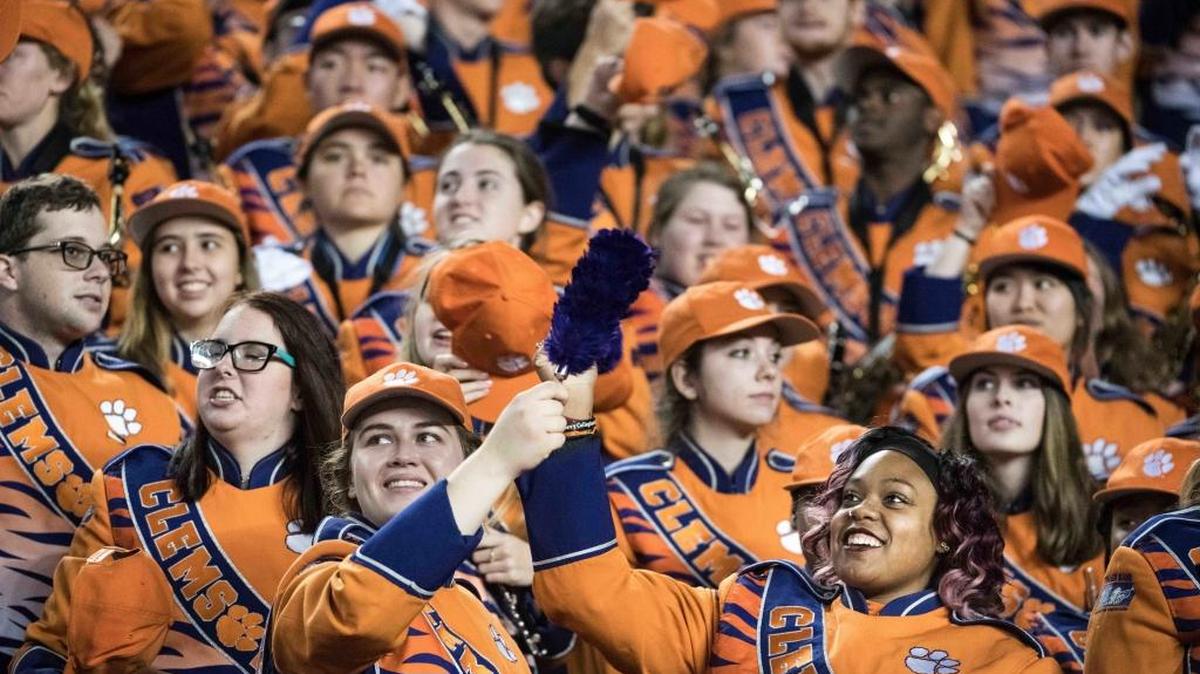 Clemson marching band members cheer for the team during the second half of an NCAA college football game against South Carolina on Saturday, Nov. 25, 2017, in Columbia, S.C.