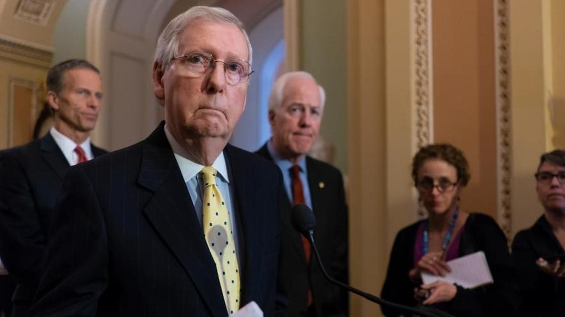 Senate Majority Leader Mitch McConnell, R-Ky., joined from left by Sen. John Thune, R-S.D., and Majority Whip John Cornyn, R-Texas, speaks to reporters following a closed-door strategy session on Capitol Hill in Washington Tuesday.