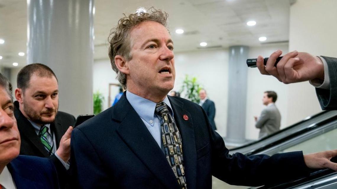 Sen. Rand Paul, R-Ky., speaks to reporters as he walks towards the Senate as Congress moves closer to the funding deadline to avoid a government shutdown on Capitol Hill in Washington Thursday.