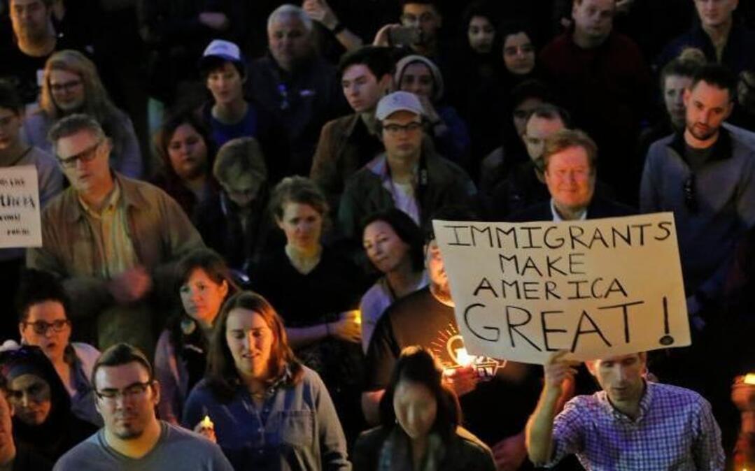 Hundreds protest at a vigil for refugees in Dallas at Thanksgiving Plaza, Jan. 30, 2017.