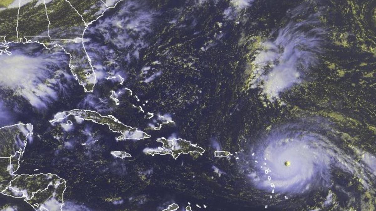In this GOES-East satellite image taken Tuesday, and released by the National Oceanic and Atmospheric Administration (NOAA), Hurricane Irma, a potentially catastrophic hurricane, moves westward in the Atlantic Ocean toward the Leeward Islands.