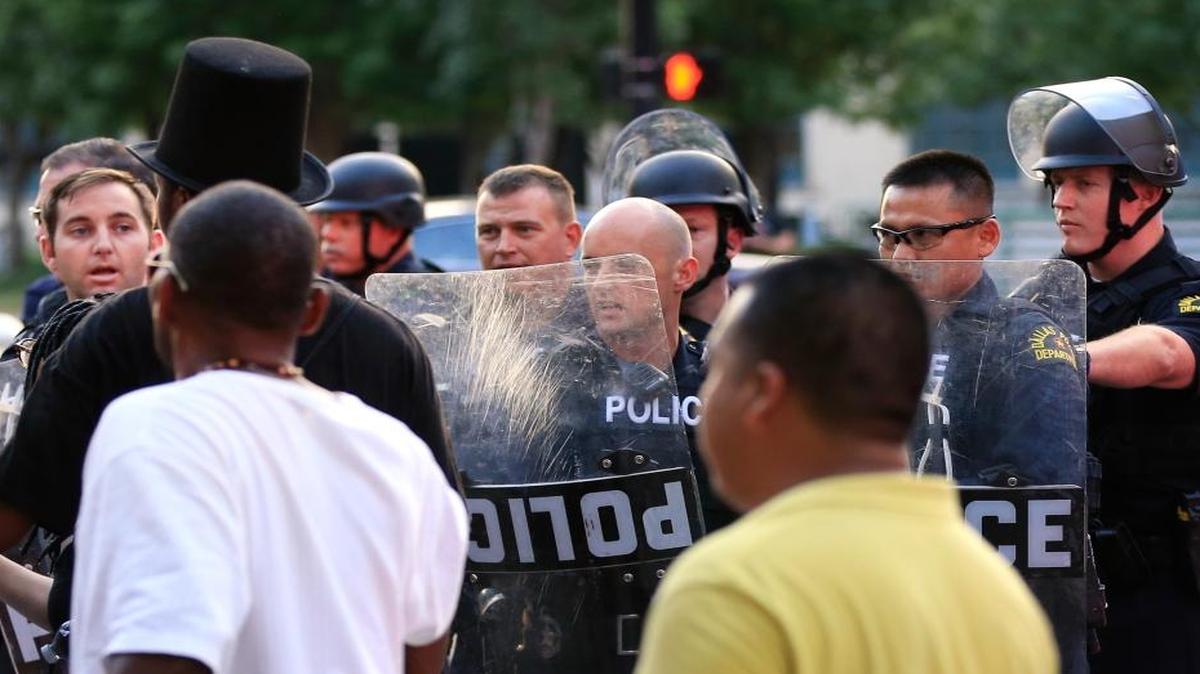 Police used shields to move protesters from the city streets during a protest in Dallas in July. The event was organized by the same activist group that organized a July 7 protest that ended with the fatal shootings of five police officers.