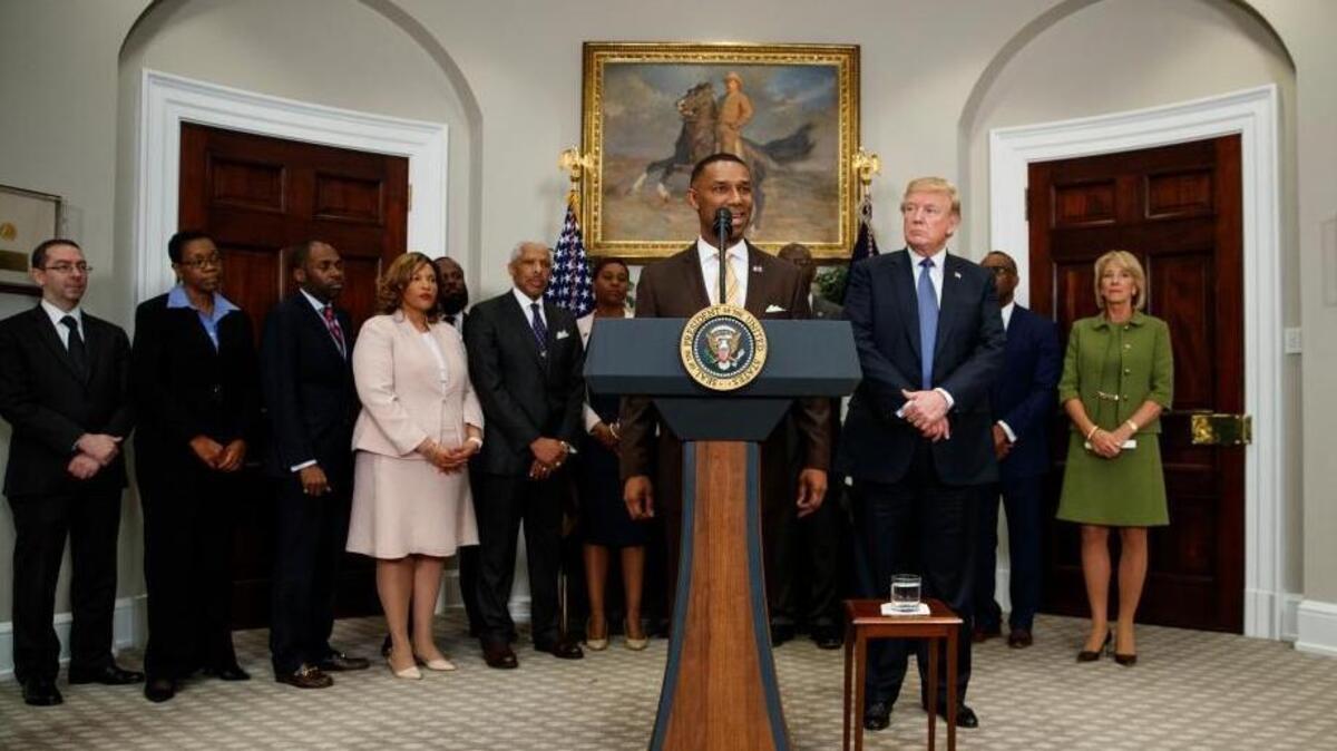 Johnny C. Taylor Jr. speaks during an event in the Roosevelt Room of the White House in Washington, Tuesday, Feb. 27, 2018, to announce Taylor as chairman of the President Donald Trump's board of advisors on Historically Black Colleges and Universities (HBCU.) Education Secretary Betsy DeVos, is right, and second from right is Johnathan Holifield executive director HBCU.