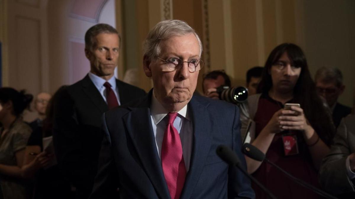 Senate Majority Leader Mitch McConnell, R-Ky., joined by Sen. John Thune, R-S.D., left, reacts to questions from reporters, Tuesday, May 16, 2017, on Capitol Hill.