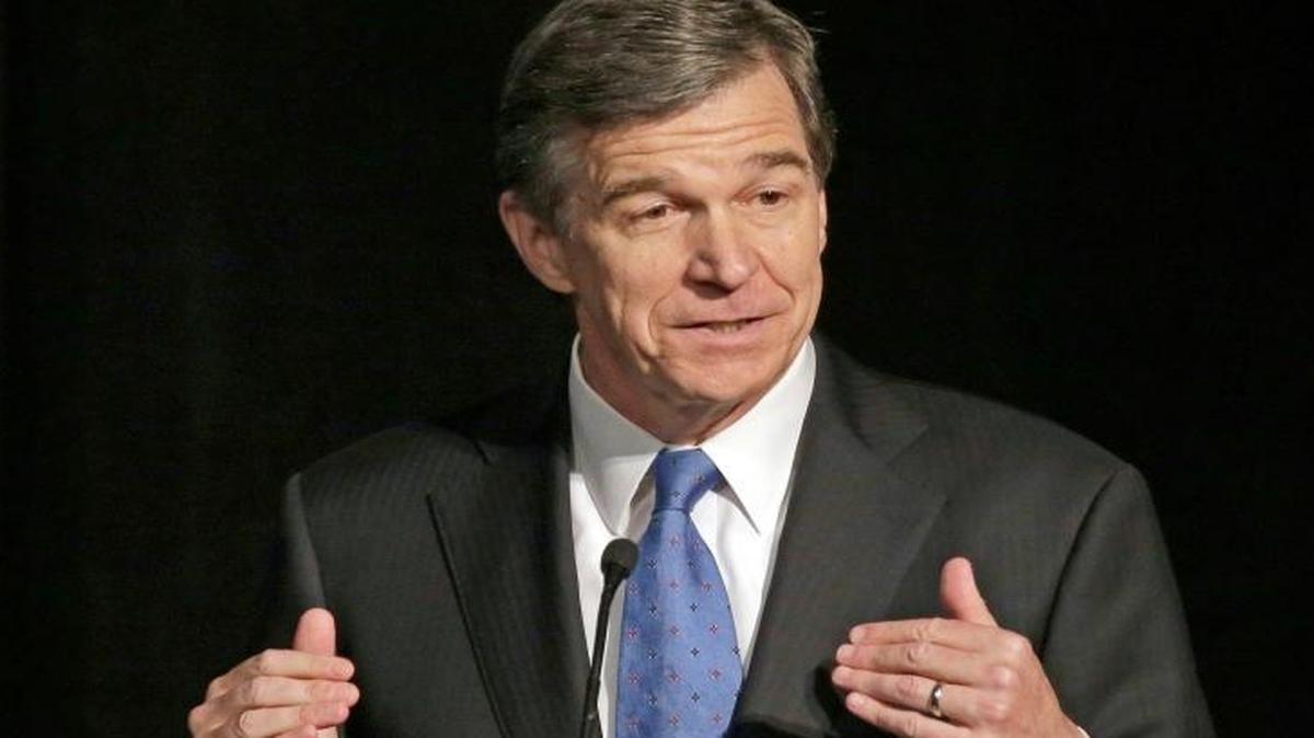 In this June 24, 2016, file photo, North Carolina Attorney General Roy Cooper speaks during a forum in Charlotte, N.C. Cooper, North Carolina's next Democratic governor, has vowed to keep his campaign promises to bend back the rightward course of the state. But with only a 10,000-vote victory over GOP Gov. Pat McCrory and bitter partisan distrust in this deeply divided state, he’s already slipped along the rocky path he must walk to work successfully with the Legislature. And Republicans will maintain veto-proof majorities in 2017.