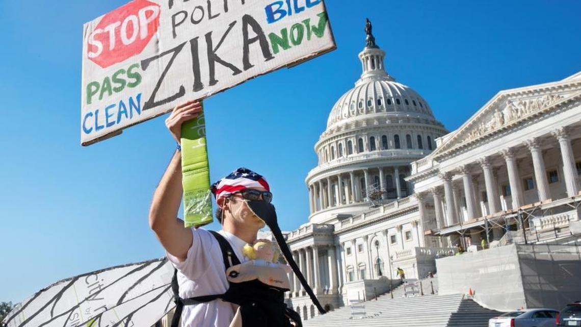 A demonstrator outside the U.S. Capitol on Sept. 14, 2016, protests the lack of congressional action on Zika funding.