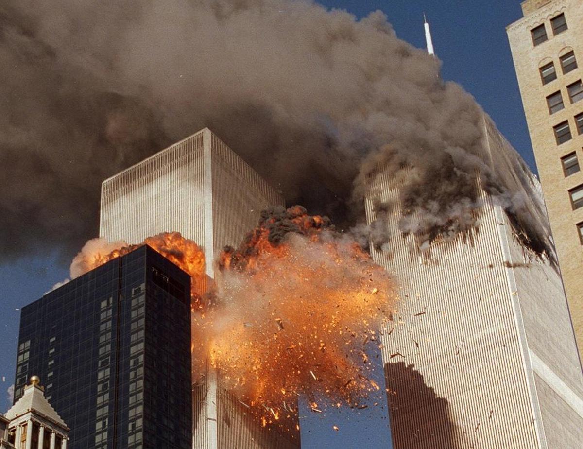 Smoke billowed from World Trade Center Tower 1 and flames exploded from Tower 2 as it was struck by American Airlines Flight 175, in New York.
