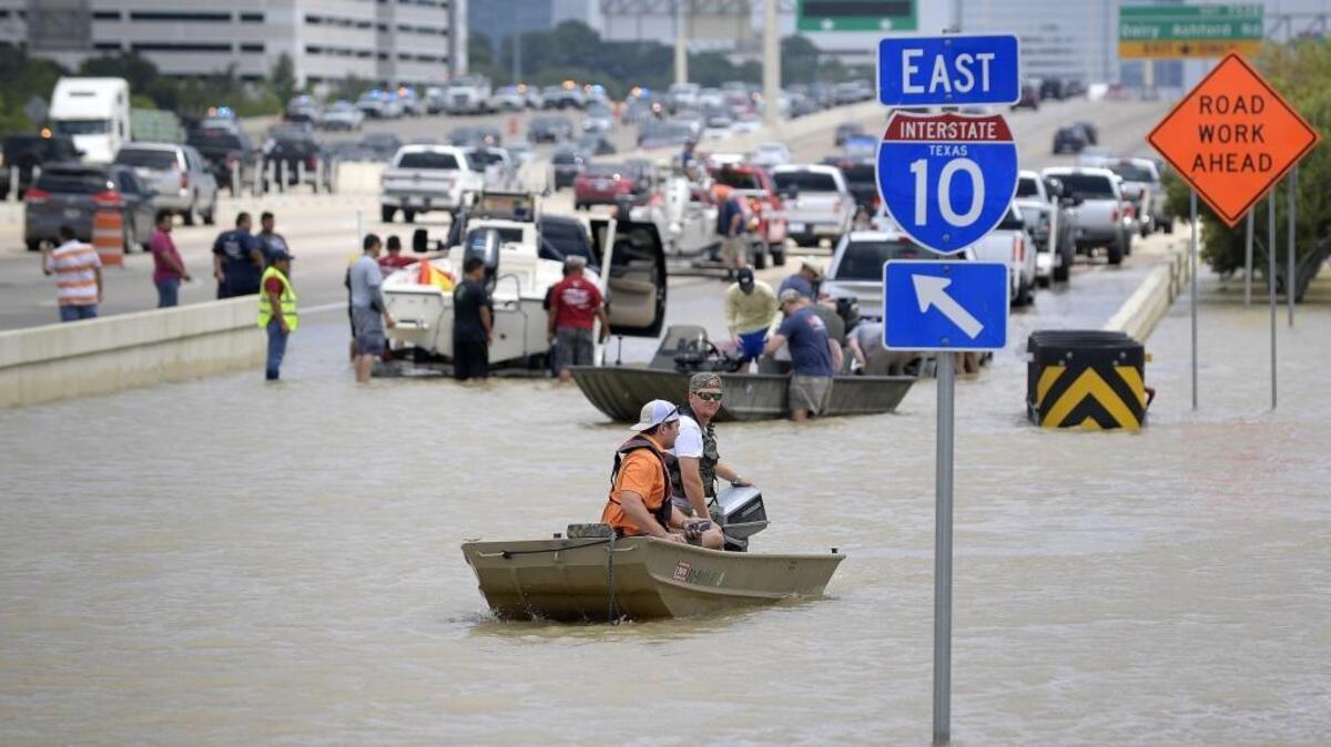 An entrance ramp to Interstate 10 became a boat ramp as volunteers brought their boats to help when Hurricane Harvey dumped 50 inches of rain in Houston.